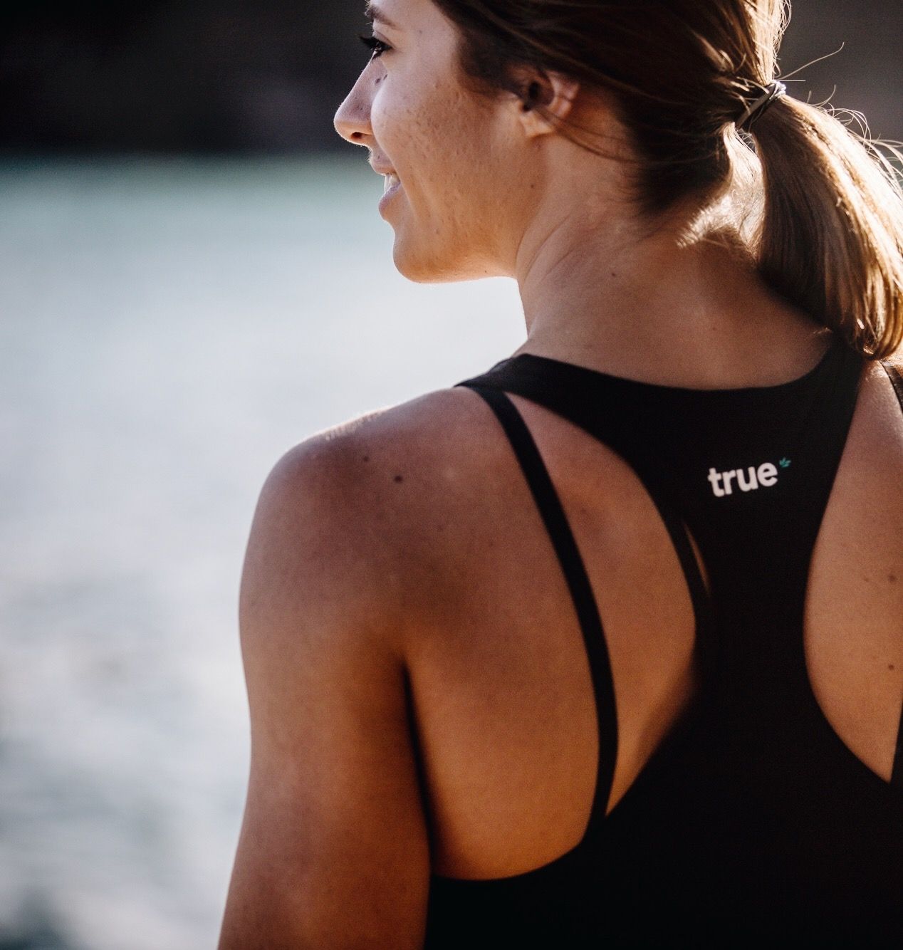 Bree Wearing True Singlet Looking Away